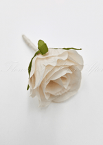 Artificial wedding boutonniere, top view of a cream faux rosebud with green sepals and an ivory stem. For formals, proms and ball occasions. Made in Melbourne by Flowers For Ever After, shipping Australia and Worldwide.