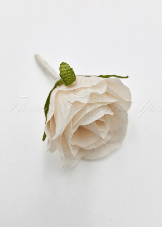 Artificial wedding boutonniere, top view of a cream faux rosebud with green sepals and an ivory stem. For formals, proms and ball occasions. Made in Melbourne by Flowers For Ever After, shipping Australia and Worldwide.