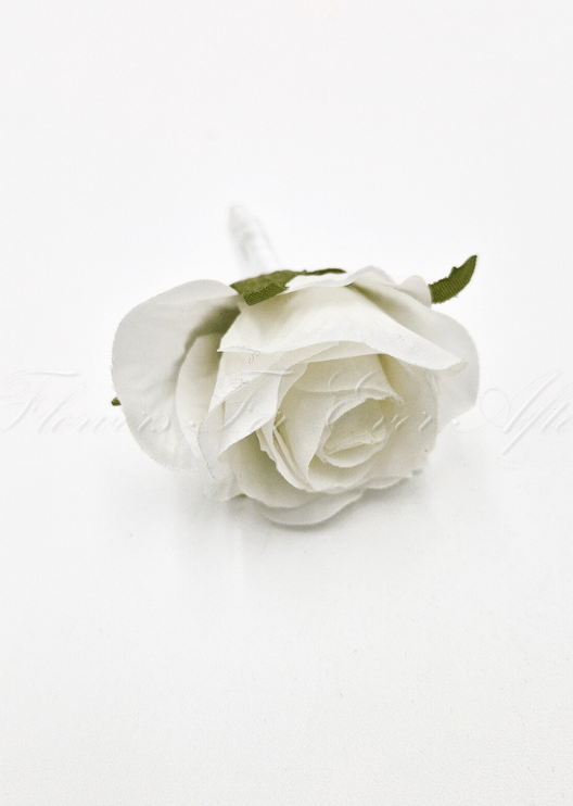 Artificial wedding boutonniere, top view of a white faux rosebud and green sepals. For formals, proms and ball occasions. Made in Melbourne by Flowers For Ever After, shipping Australia and Worldwide.