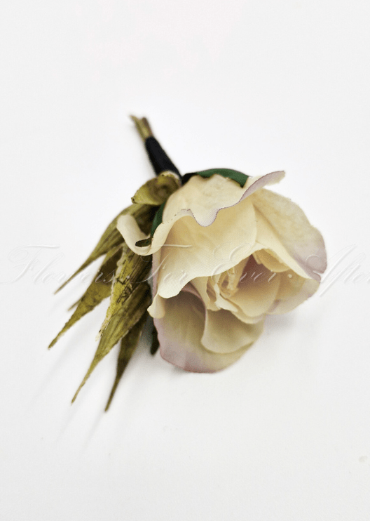 Artificial wedding boutonniere, top view of a cream faux rosebud and green sepals. For formals, proms and ball occasions. Made in Melbourne by Flowers For Ever After, shipping Australia and Worldwide.