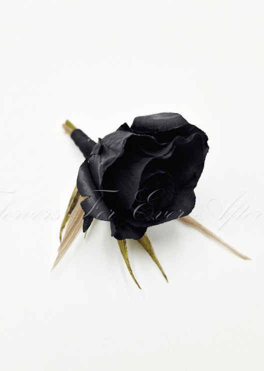 Artificial wedding boutonniere, top view of a black faux rosebud and green sepals. For formals, proms and ball occasions. Made in Melbourne by Flowers For Ever After, shipping Australia and Worldwide.