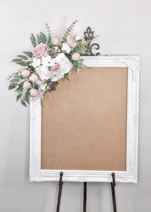 Artificial wedding sign decoration with blush and white faux roses, white hydrangea and eucalyptus at the upper corner. Made in Melbourne by Flowers For Ever After, shipping Australia and Worldwide.