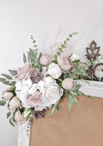 Artificial wedding sign flower arrangement, angled view of blush and white faux roses, hydrangea and eucalyptus at the upper corner. Made in Melbourne by Flowers For Ever After, shipping Australia and Worldwide.