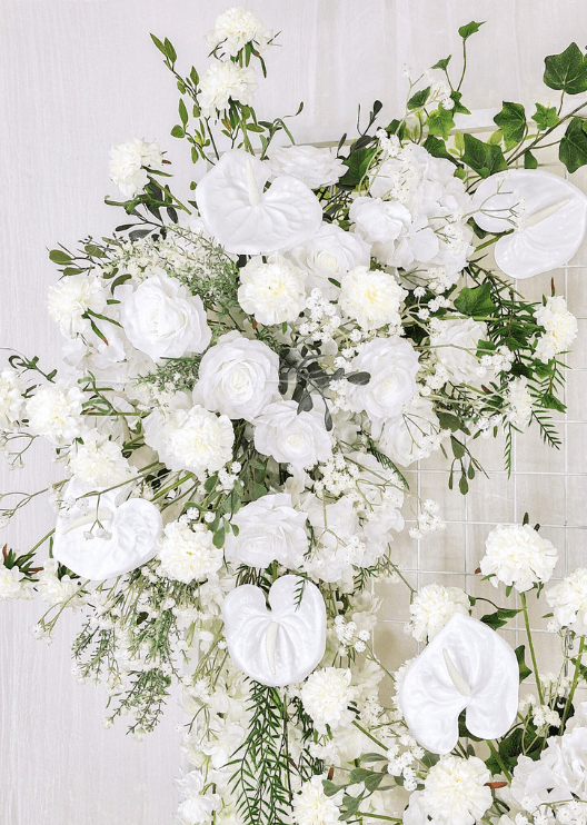 Artificial wedding ceremony arrangement close-up showing faux flower petals, smaller blooms and green leaves. Made in Melbourne by Flowers For Ever After, shipping Australia and Worldwide.