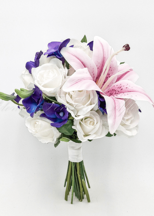 Artificial wedding bridal bouquet close-up showing pink faux lily petals and purple orchids. Made in Melbourne by Flowers For Ever After, shipping Australia and Worldwide.