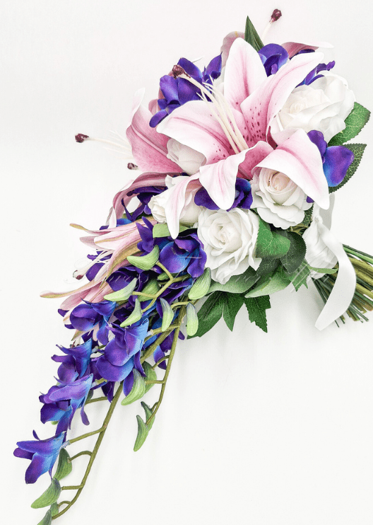 Artificial wedding bridesmaid posy close-up showing pink faux lily petals and purple orchids. Made in Melbourne by Flowers For Ever After, shipping Australia and Worldwide.