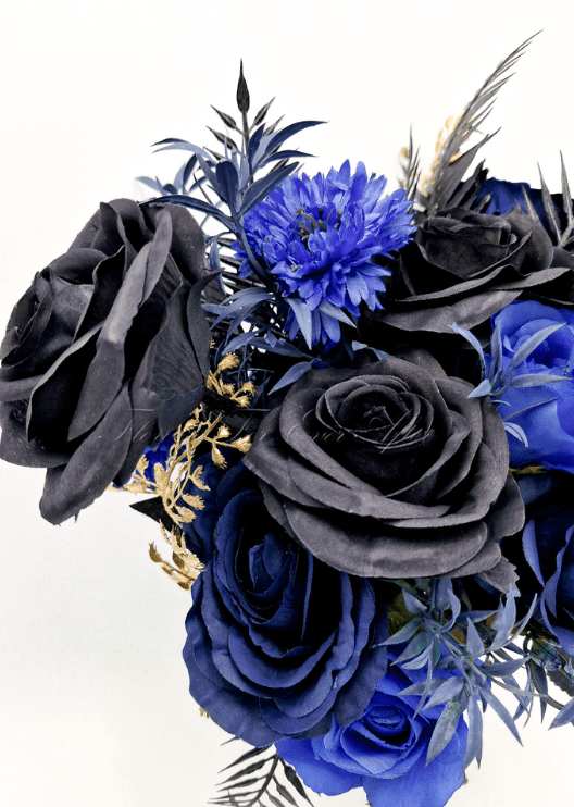 Artificial wedding bridesmaid posy, angled view of mixed faux flowers and green leaves. Made in Melbourne by Flowers For Ever After, shipping Australia and Worldwide.