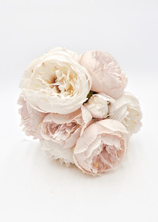 Artificial wedding bridal bouquet, angled view of white and blush faux peonies and green leaves. Made in Melbourne by Flowers For Ever After, shipping Australia and Worldwide.