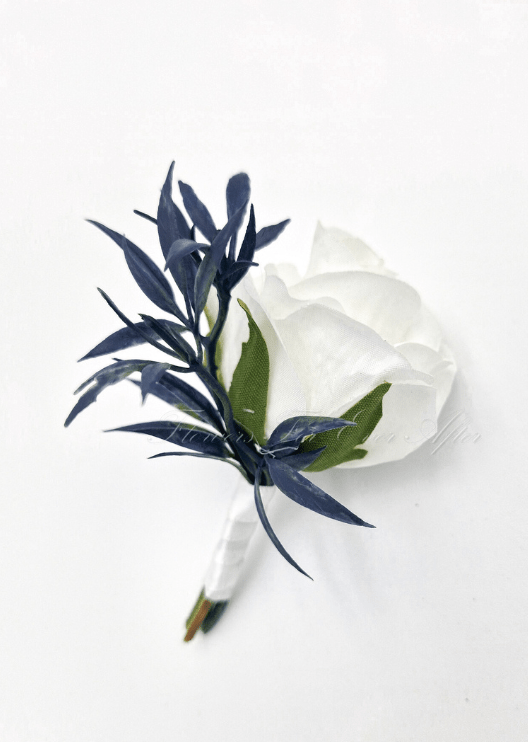Artificial wedding boutonniere with a white faux rose, small flowers and green leaves, with wrapped stems. For formals, proms and ball occasions. Made in Melbourne by Flowers For Ever After, shipping Australia and Worldwide.