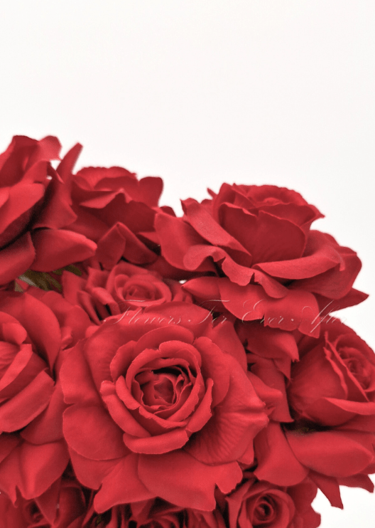 Artificial wedding bouquet close-up showing faux roses, smaller flowers and green foliage. Made in Melbourne by Flowers For Ever After, shipping Australia and Worldwide.