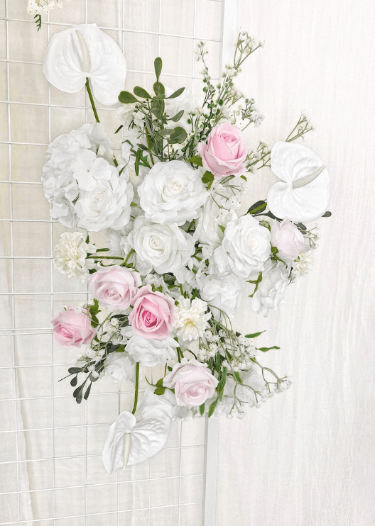 Artificial wedding ceremony floral pair, angled view of pink and white faux roses, white anthuriums, hydrangea and trailing greenery. Made in Melbourne by Flowers For Ever After, shipping Australia and Worldwide.