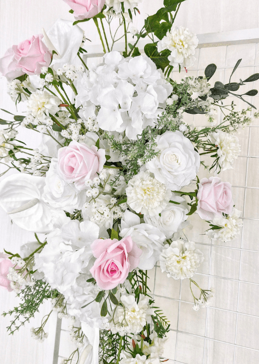 Artificial wedding ceremony floral close-up with pink and white faux roses, white anthuriums, hydrangea and delicate white flowers. Made in Melbourne by Flowers For Ever After, shipping Australia and Worldwide.
