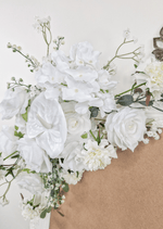 Artificial wedding sign flower close-up showing white faux rose petals, small white flowers and green sprigs. Made in Melbourne by Flowers For Ever After, shipping Australia and Worldwide.