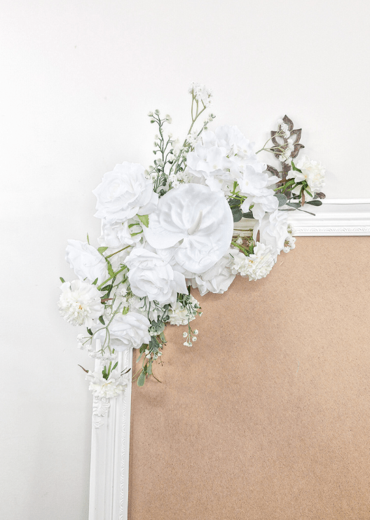 Artificial wedding sign decoration, angled view of white faux roses, white flowers and branching pale sprigs. Made in Melbourne by Flowers For Ever After, shipping Australia and Worldwide.