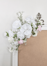 Artificial wedding sign decoration close-up with white faux roses, pale pink roses, white blooms and branching white sprigs. Made in Melbourne by Flowers For Ever After, shipping Australia and Worldwide.