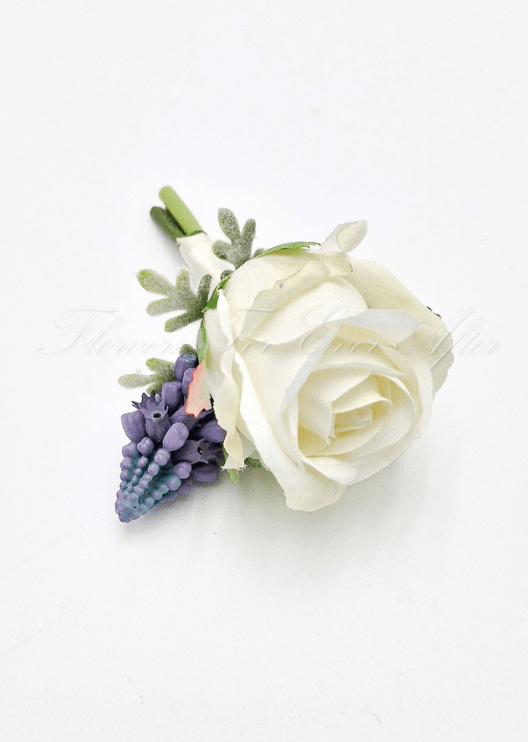 Artificial wedding boutonniere, top view of a cream faux rose, purple flower spike and pale silver sprigs. For formals, proms and ball occasions. Made in Melbourne by Flowers For Ever After, shipping Australia and Worldwide.