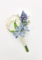 Artificial wedding boutonniere with a cream faux rose, purple flower spike, dusty blue hydrangea and wrapped stems. For formals, proms and ball occasions. Made in Melbourne by Flowers For Ever After, shipping Australia and Worldwide.