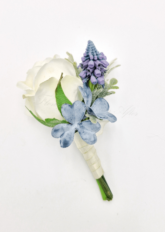 Artificial wedding boutonniere with a cream faux rose, purple flower spike, dusty blue hydrangea and wrapped stems. For formals, proms and ball occasions. Made in Melbourne by Flowers For Ever After, shipping Australia and Worldwide.
