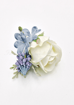 Artificial wedding boutonniere, top view of a cream faux rose, purple flower spike and dusty blue hydrangea. For formals, proms and ball occasions. Made in Melbourne by Flowers For Ever After, shipping Australia and Worldwide.