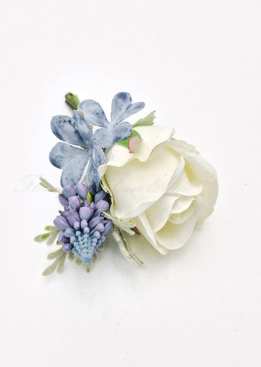 Artificial wedding boutonniere, top view of a cream faux rose, purple flower spike and dusty blue hydrangea. For formals, proms and ball occasions. Made in Melbourne by Flowers For Ever After, shipping Australia and Worldwide.