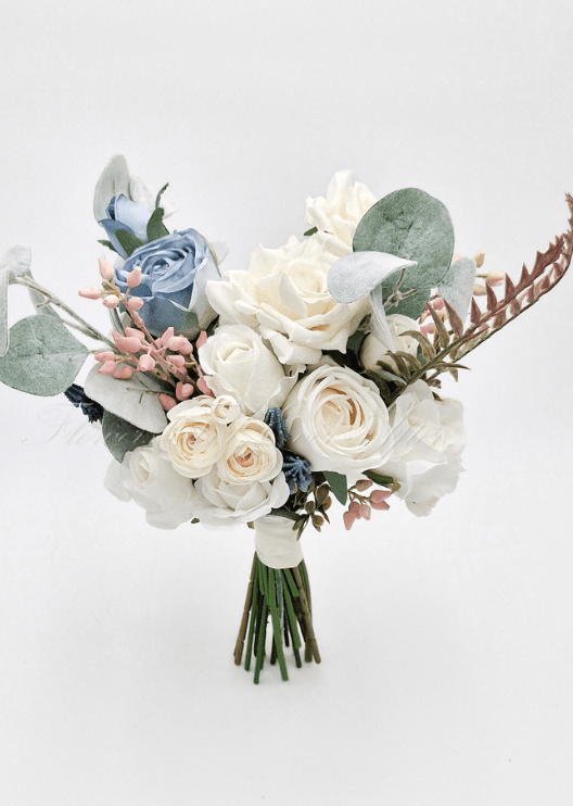 Artificial wedding bridesmaid bouquet close-up with cream and dusty blue faux roses, eucalyptus leaves and pale pink berries. Made in Melbourne by Flowers For Ever After, shipping Australia and Worldwide.