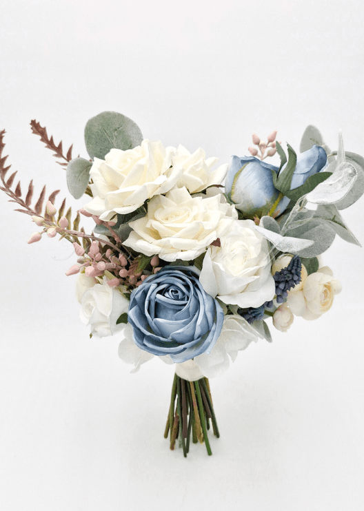 Artificial wedding bridesmaid bouquet with cream and dusty blue faux roses, eucalyptus, pink berries and burgundy fern-like sprigs. Made in Melbourne by Flowers For Ever After, shipping Australia and Worldwide.