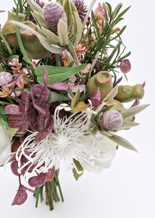 Artificial wedding bridesmaid bouquet close-up showing native-style faux blooms and smaller flowers. Made in Melbourne by Flowers For Ever After, shipping Australia and Worldwide.