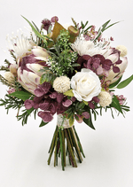 Artificial wedding bridal bouquet, angled view of native-style faux blooms and green foliage. Made in Melbourne by Flowers For Ever After, shipping Australia and Worldwide.