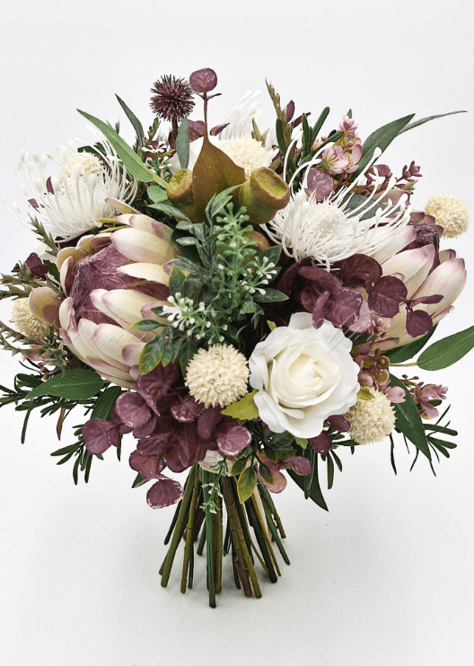 Artificial wedding bridal bouquet with native-style faux flowers, small blooms and green leaves. Made in Melbourne by Flowers For Ever After, shipping Australia and Worldwide.