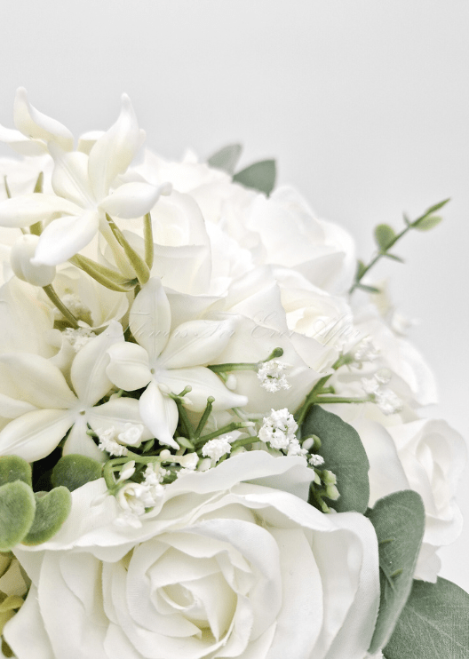 Artificial wedding bouquet close-up showing layered faux flower petals and green foliage. Made in Melbourne by Flowers For Ever After, shipping Australia and Worldwide.