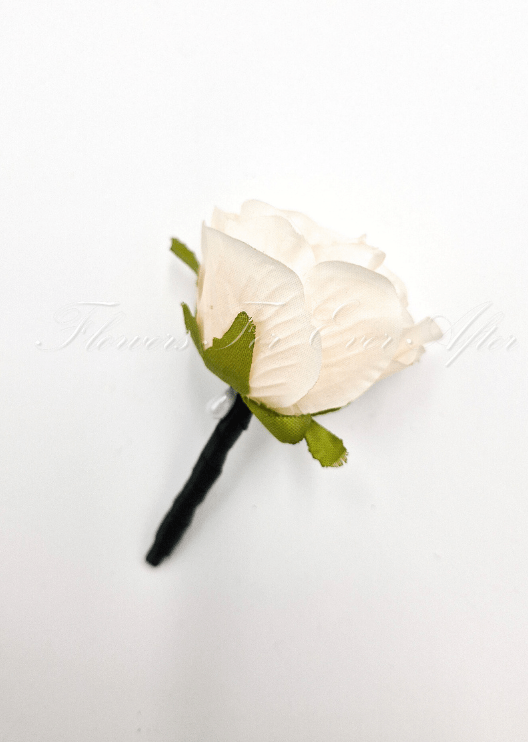 Artificial wedding boutonniere with a cream faux rosebud, green sepals and a black-wrapped stem. For formals, proms and ball occasions. Made in Melbourne by Flowers For Ever After, shipping Australia and Worldwide.