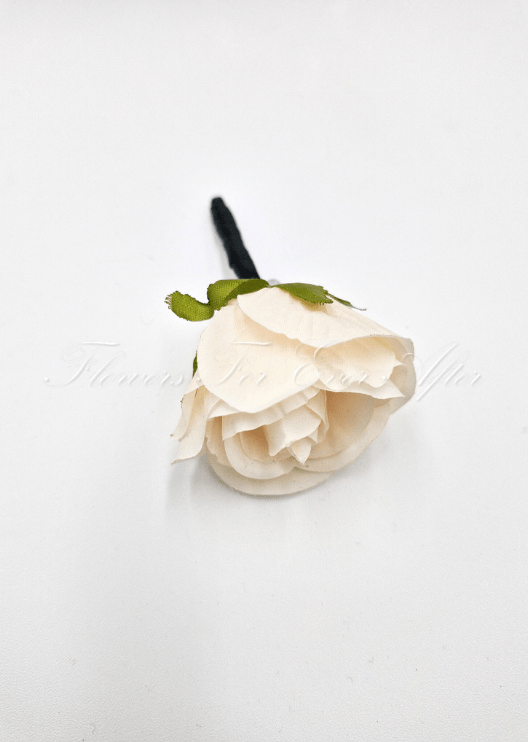 Artificial wedding boutonniere, top view of a cream faux rosebud with green sepals and a black stem. For formals, proms and ball occasions. Made in Melbourne by Flowers For Ever After, shipping Australia and Worldwide.