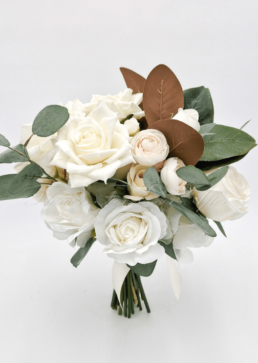Artificial wedding bridesmaid bouquet, reverse view of ivory faux roses, pale blooms, eucalyptus and brown magnolia leaves. Made in Melbourne by Flowers For Ever After, shipping Australia and Worldwide.