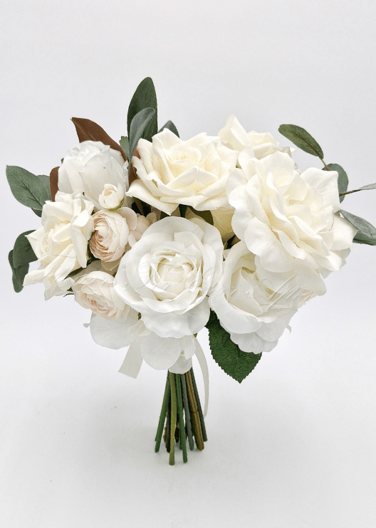 Artificial wedding bridesmaid bouquet with ivory faux roses, pale ranunculus, white flowers, eucalyptus and wrapped stems. Made in Melbourne by Flowers For Ever After, shipping Australia and Worldwide.