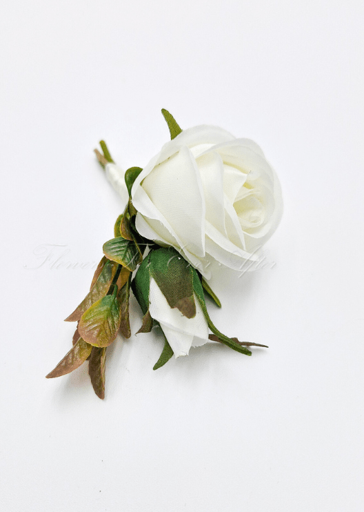 Artificial wedding boutonniere, top view of an ivory faux rose with brown-green leaves. For formals, proms and ball occasions. Made in Melbourne by Flowers For Ever After, shipping Australia and Worldwide.