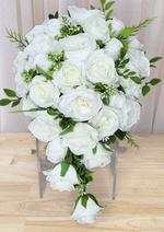 Artificial wedding cascading bouquet with white faux roses and peonies, tiny white buds, green leaves and trailing white rosebuds. Made in Melbourne by Flowers For Ever After, shipping Australia and Worldwide.
