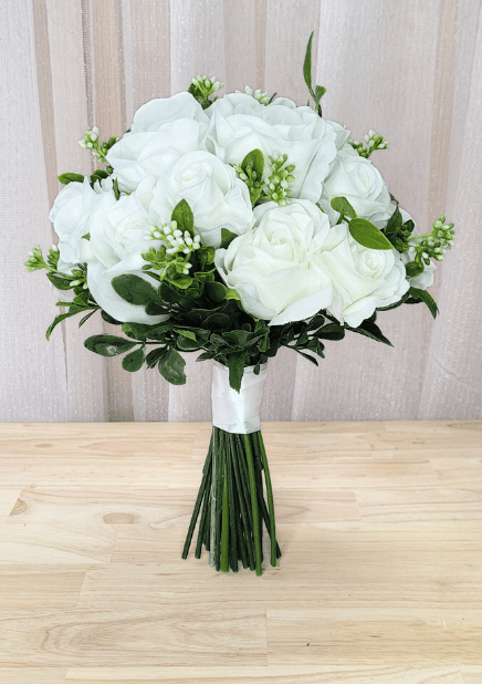 Artificial wedding bridesmaid bouquet with white faux roses and peonies, tiny white buds and rounded green leaves. Made in Melbourne by Flowers For Ever After, shipping Australia and Worldwide.