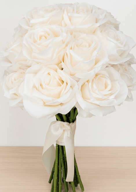 Artificial wedding bridal bouquet with ivory faux roses, ivory ribbon bow and gathered green stems. Made in Melbourne by Flowers For Ever After, shipping Australia and Worldwide.
