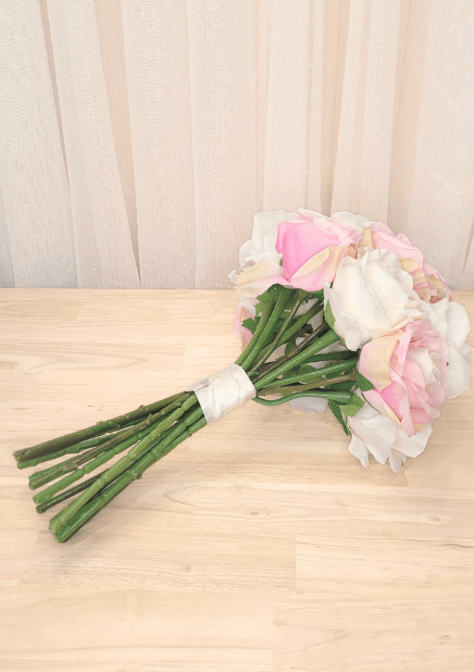 Artificial wedding bouquet, reverse view of pink and ivory faux roses, green sepals and ivory-wrapped stems. Made in Melbourne by Flowers For Ever After, shipping Australia and Worldwide.