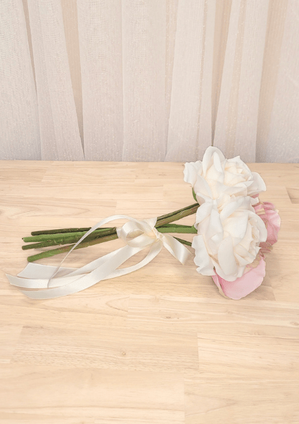 Artificial wedding small bouquet, reverse side view of pink and ivory faux roses, green stems and ivory bow. Made in Melbourne by Flowers For Ever After, shipping Australia and Worldwide.