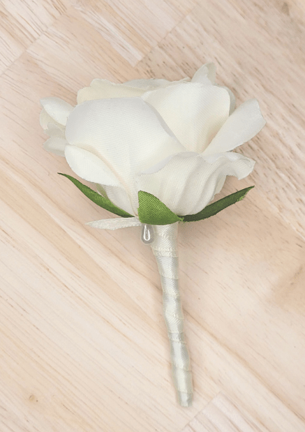 Artificial wedding boutonniere with ivory faux rose, green sepals and ivory-wrapped stem. For formals, proms and ball occasions. Made in Melbourne by Flowers For Ever After, shipping Australia and Worldwide.