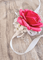Artificial wedding wrist corsage close-up with hot pink faux roses, pale flowers and ivory ribbons. For formals, proms and ball occasions. Made in Melbourne by Flowers For Ever After, shipping Australia and Worldwide.