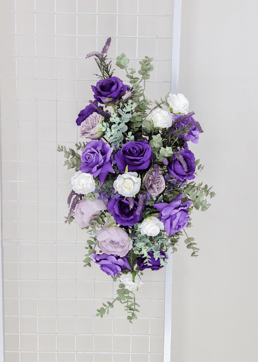 Artificial wedding ceremony arrangement with purple faux blooms, small flowers and green leaves. Made in Melbourne by Flowers For Ever After, shipping Australia and Worldwide.