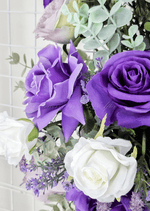 Artificial wedding ceremony floral display with purple faux blooms and cascading green leaves. Made in Melbourne by Flowers For Ever After, shipping Australia and Worldwide.