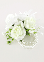 Artificial wedding wrist corsage with white faux roses, tiny white flowers and a double-row pearl-style bracelet. For formals, proms and ball occasions. Made in Melbourne by Flowers For Ever After, shipping Australia and Worldwide.