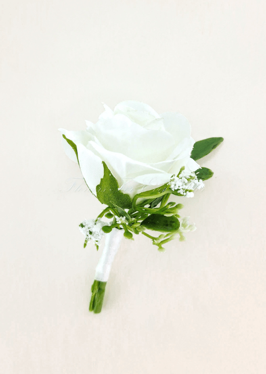 Artificial wedding boutonniere with a white faux rose, tiny white flowers, green leaves and a white-wrapped stem. For formals, proms and ball occasions. Made in Melbourne by Flowers For Ever After, shipping Australia and Worldwide.