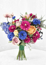 Artificial wedding bouquet with blue, orange, yellow and blush faux roses, magenta dahlias, blue cornflowers and pale pink poppies. Made in Melbourne by Flowers For Ever After, shipping Australia and Worldwide.