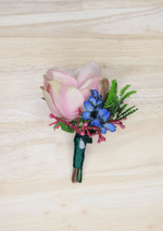 Artificial wedding boutonniere with blush faux rosebud, blue flowers, magenta sprigs, fern-like greenery and green-wrapped stem. For formals, proms and ball occasions. Made in Melbourne by Flowers For Ever After, shipping Australia and Worldwide.