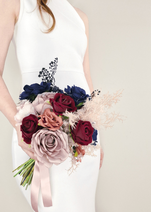 Artificial wedding bridal bouquet, angled view of mixed faux blooms and green leaves. Made in Melbourne by Flowers For Ever After, shipping Australia and Worldwide.