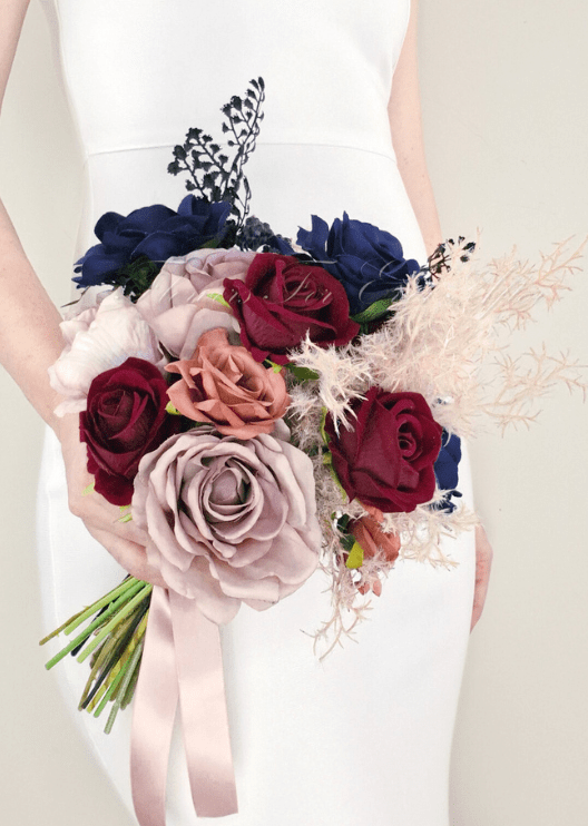 Artificial wedding bridal bouquet with mixed faux blooms, green leaves and wrapped stems. Made in Melbourne by Flowers For Ever After, shipping Australia and Worldwide.